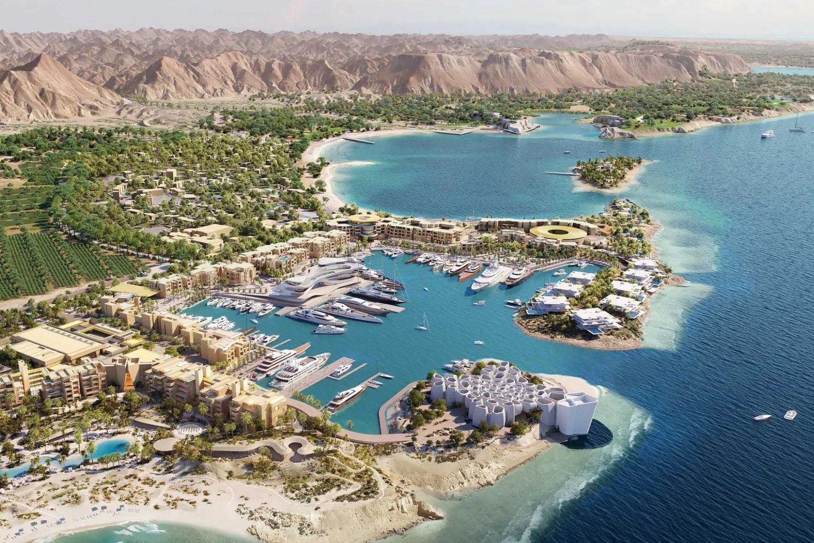 Aerial view of AMAALA marina village with the Corallium marine institute and golden landmark pavilions