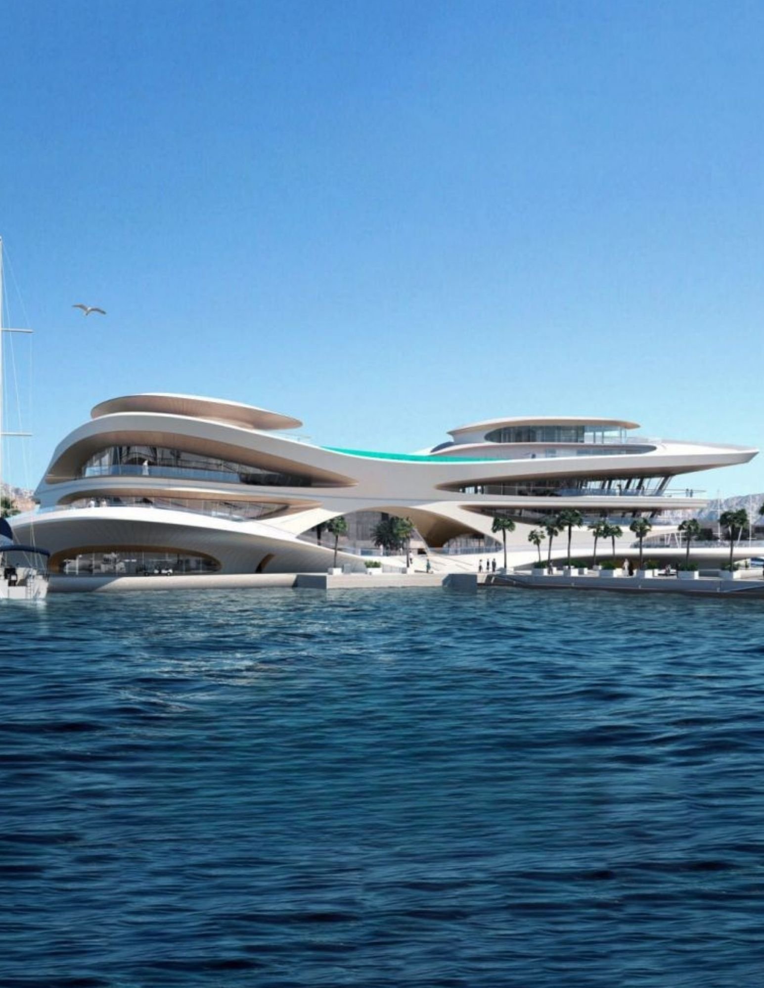 Flowing waterfront building at AMAALA with a palm-lined promenade and marina