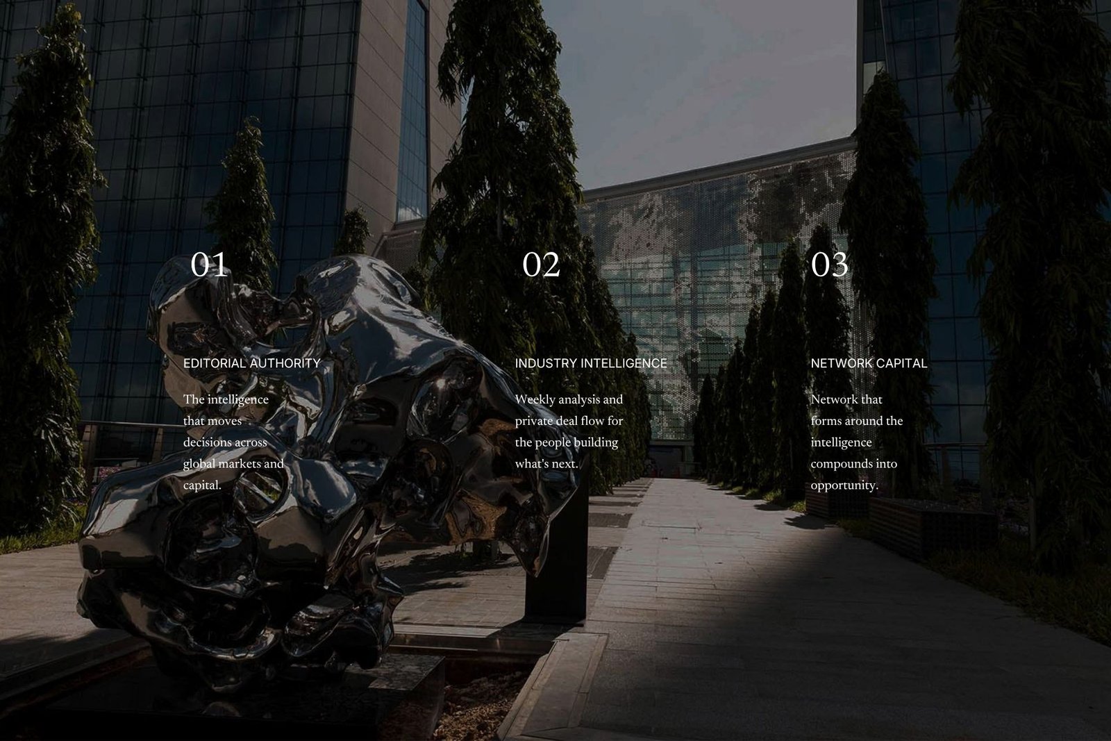 A mirrored steel sculpture in a tree-lined plaza between glass towers, darkened to frame three white editorial columns: 01 Editorial Authority, 02 Industry Intelligence, 03 Network Capital.