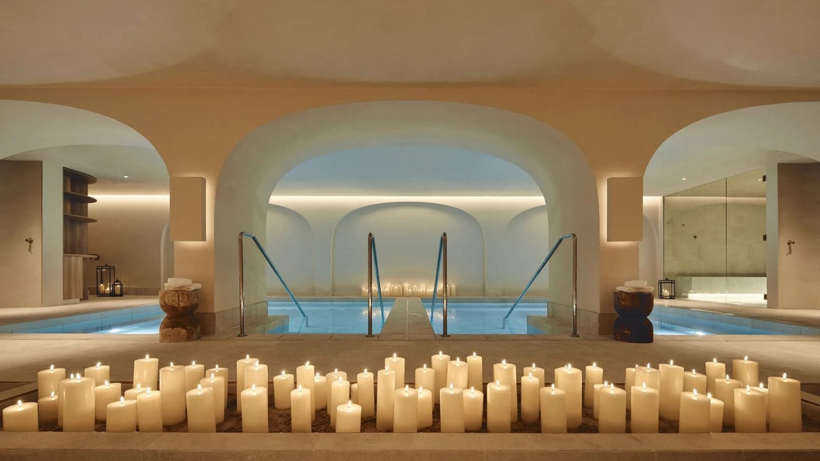 Candlelit vaulted bathhouse pool at Saint Haven