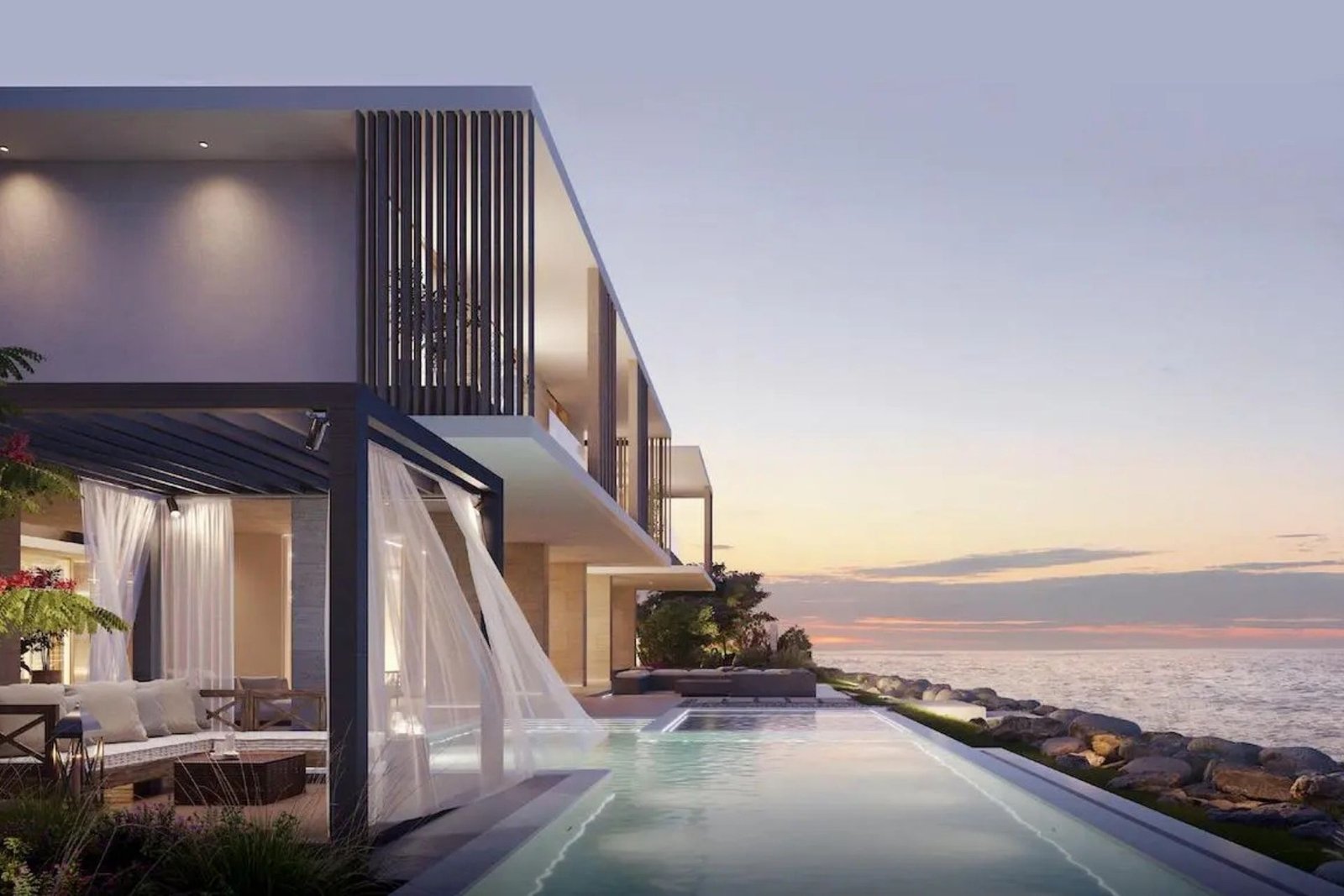 Sunset over a SHA Emirates villa with illuminated plunge pool